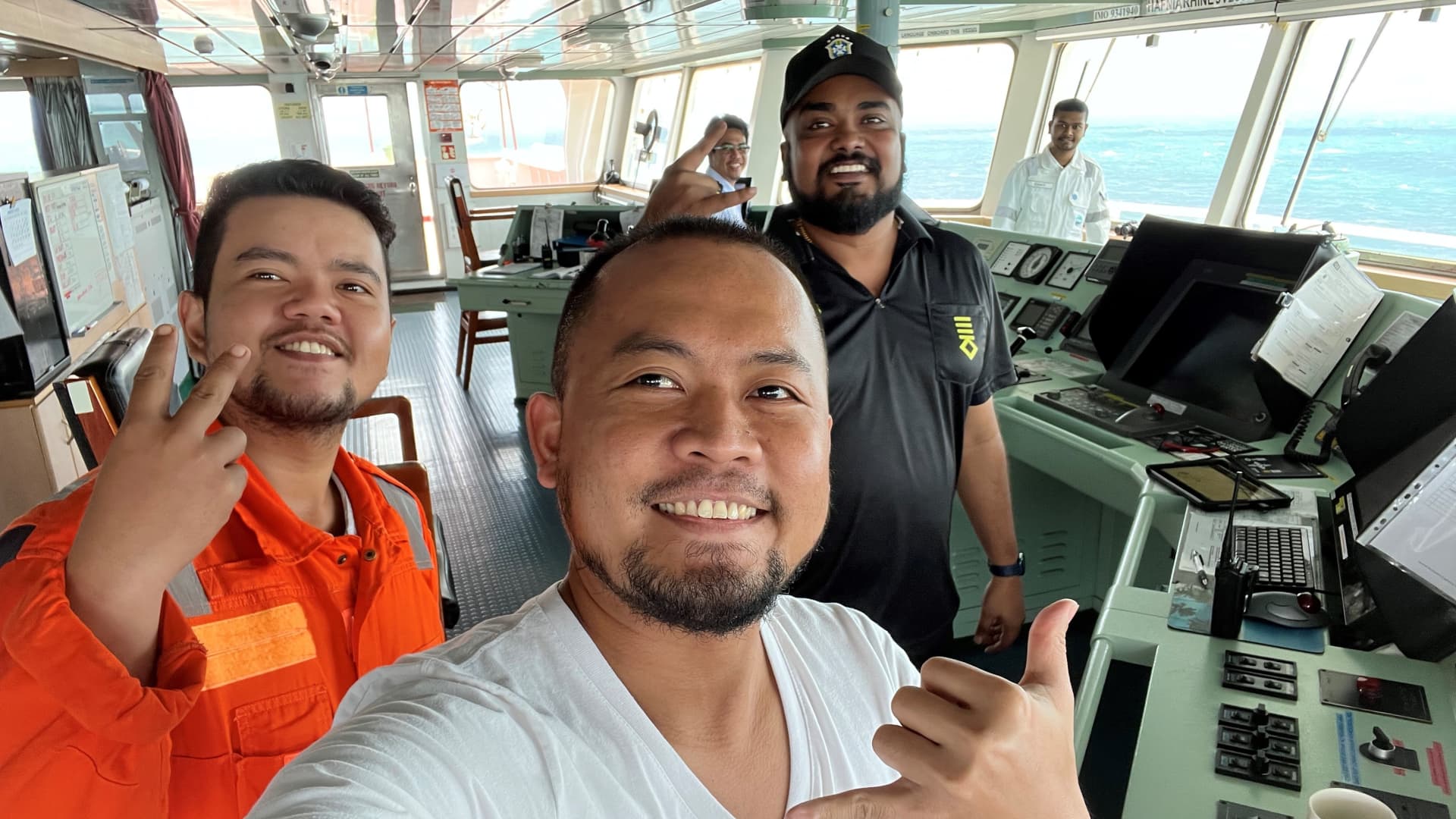 Captain DSA Dixon (in black) says he invents games to keep his crew's morale up during months at sea.